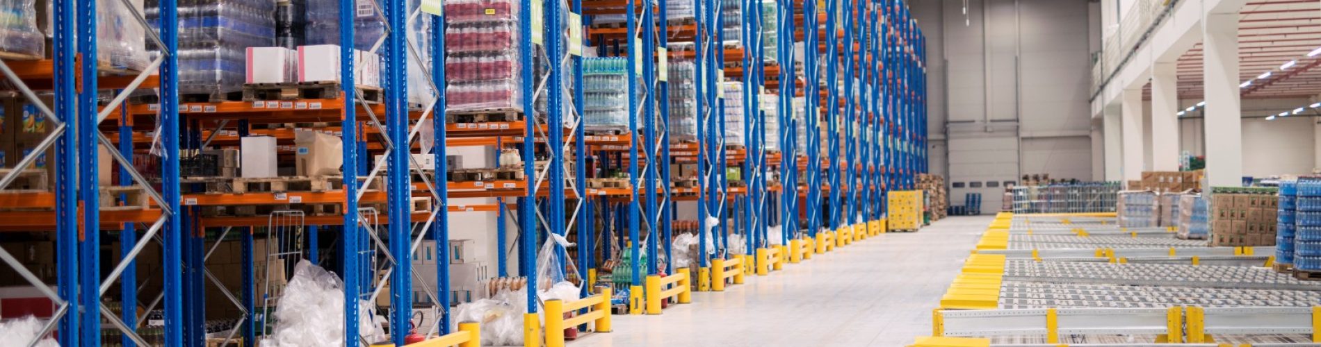 Warehouse storage interior with shelves loaded with goods.